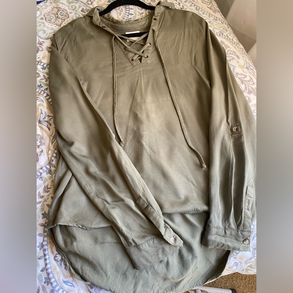 Medium size navy green long-sleeve blouse.